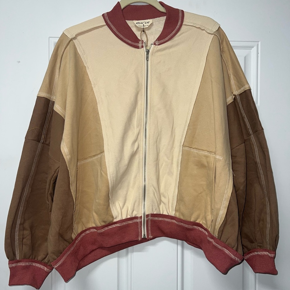 New In zip up light weight jacket size M/L